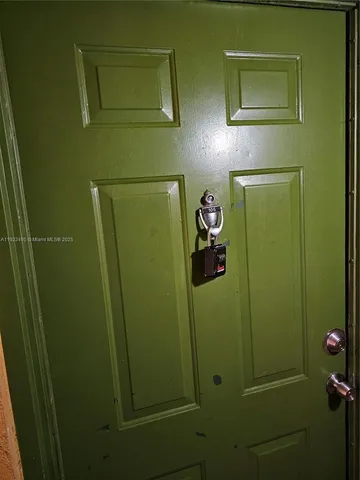 a bathroom with a shower and a mirror