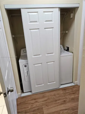 a view of a storage and utility room with closet