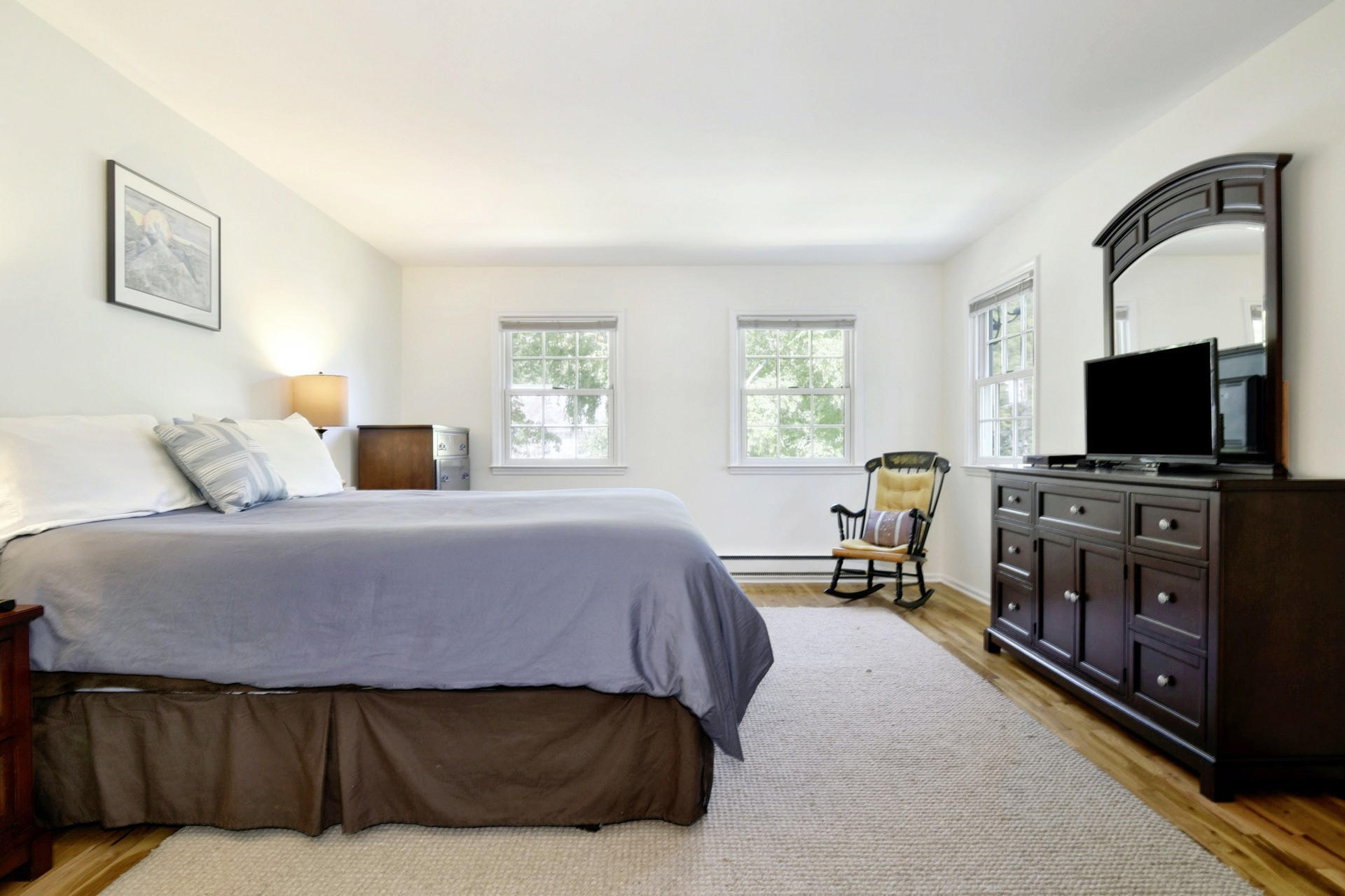 1 Country Club Road Darien, CT 06820 - Photo 12 of 25 a bedroom with a bed and a flat screen tv