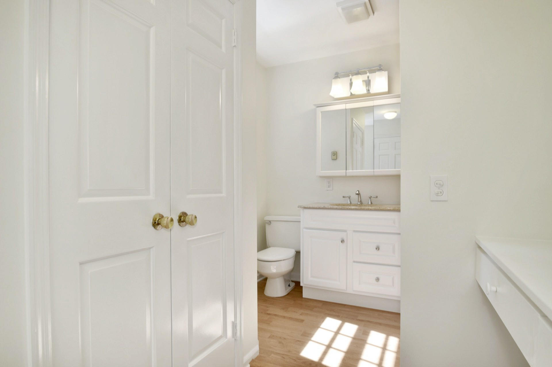 1 Country Club Road Darien, CT 06820 - Photo 13 of 25 a bathroom with a toilet sink and mirror
