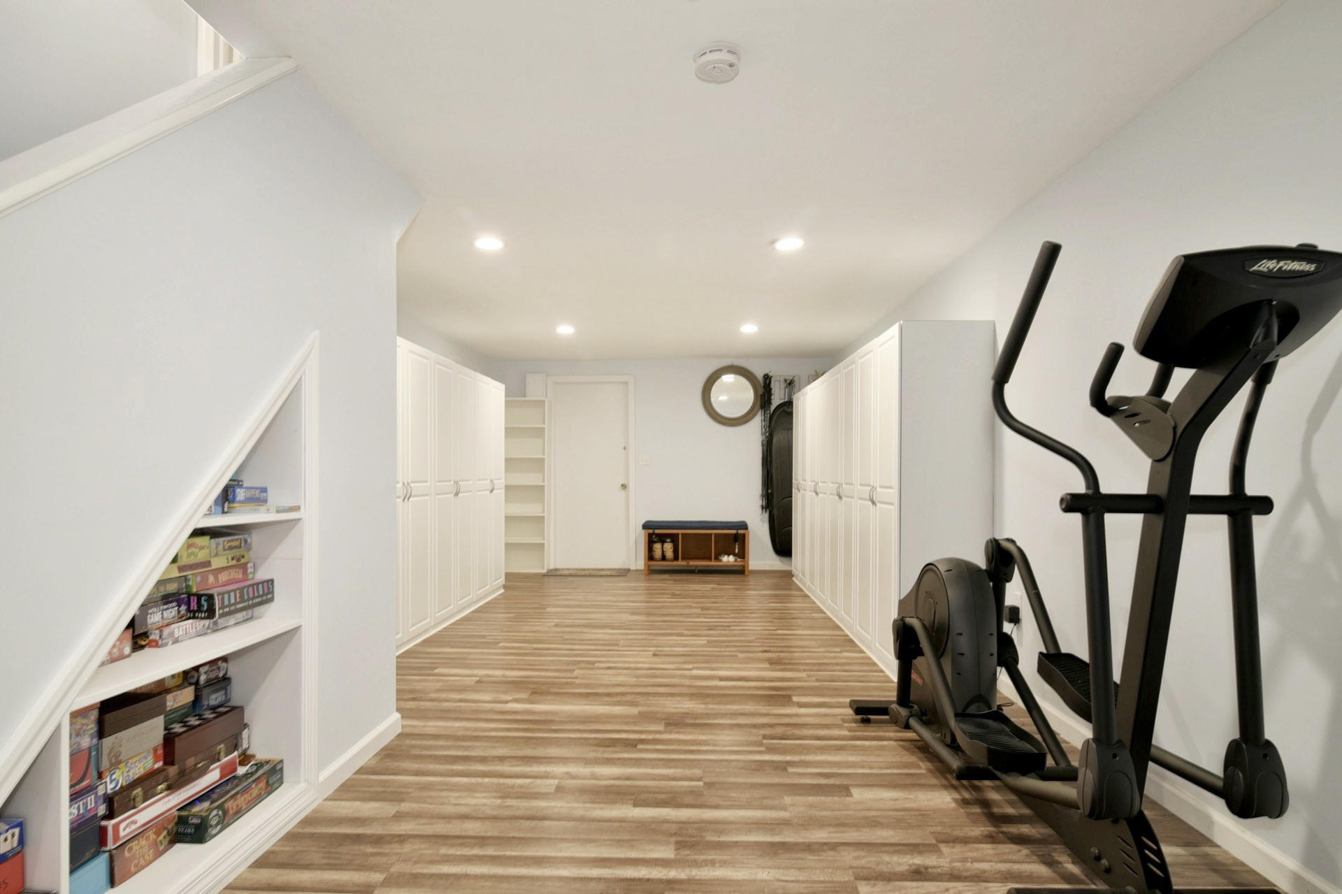 1 Country Club Road Darien, CT 06820 - Photo 21 of 25 a view of a hallway with wooden floor and stairs