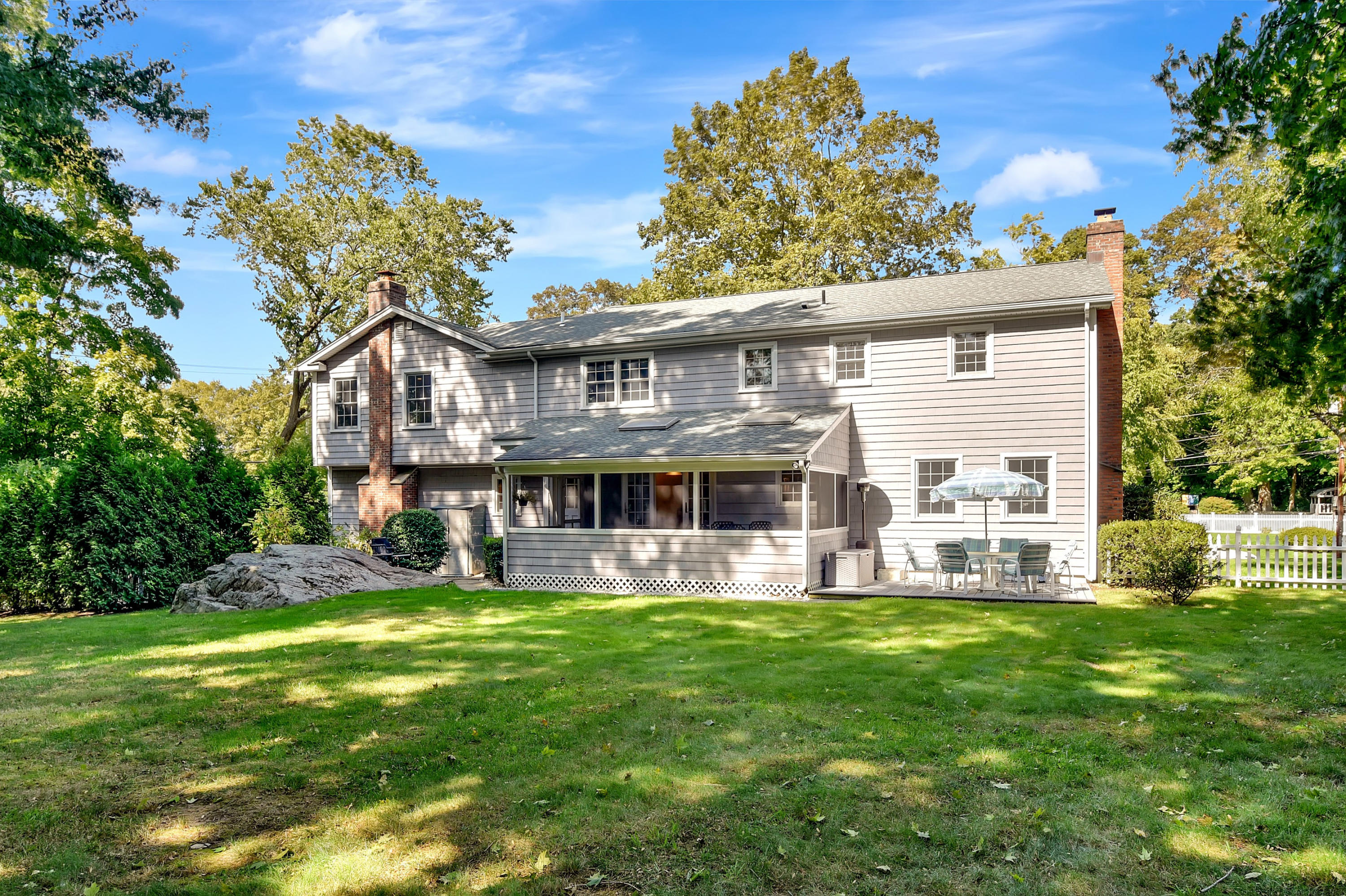 1 Country Club Road Darien, CT 06820 - Photo 23 of 25 a view of a house with a yard and sitting area