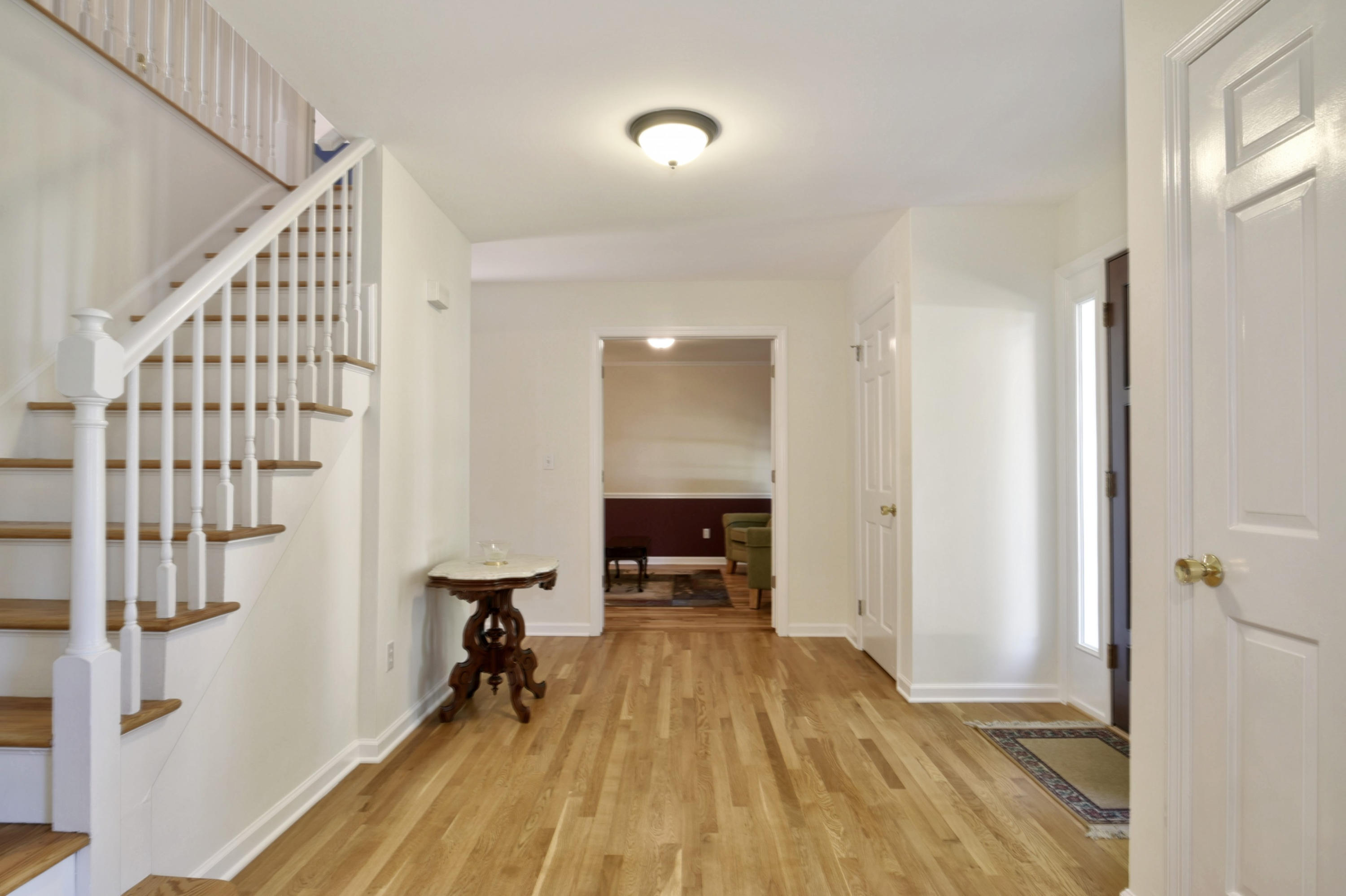 1 Country Club Road Darien, CT 06820 - Photo 4 of 25 a view of a room with wooden floor and staircase