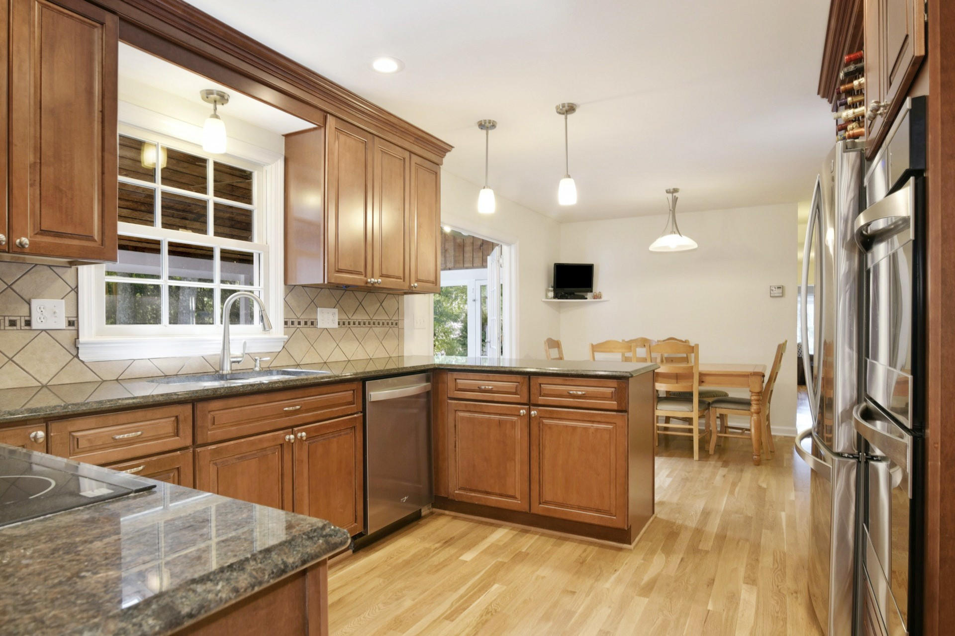 1 Country Club Road Darien, CT 06820 - Photo 7 of 25 a kitchen with granite countertop a sink cabinets and wooden floor
