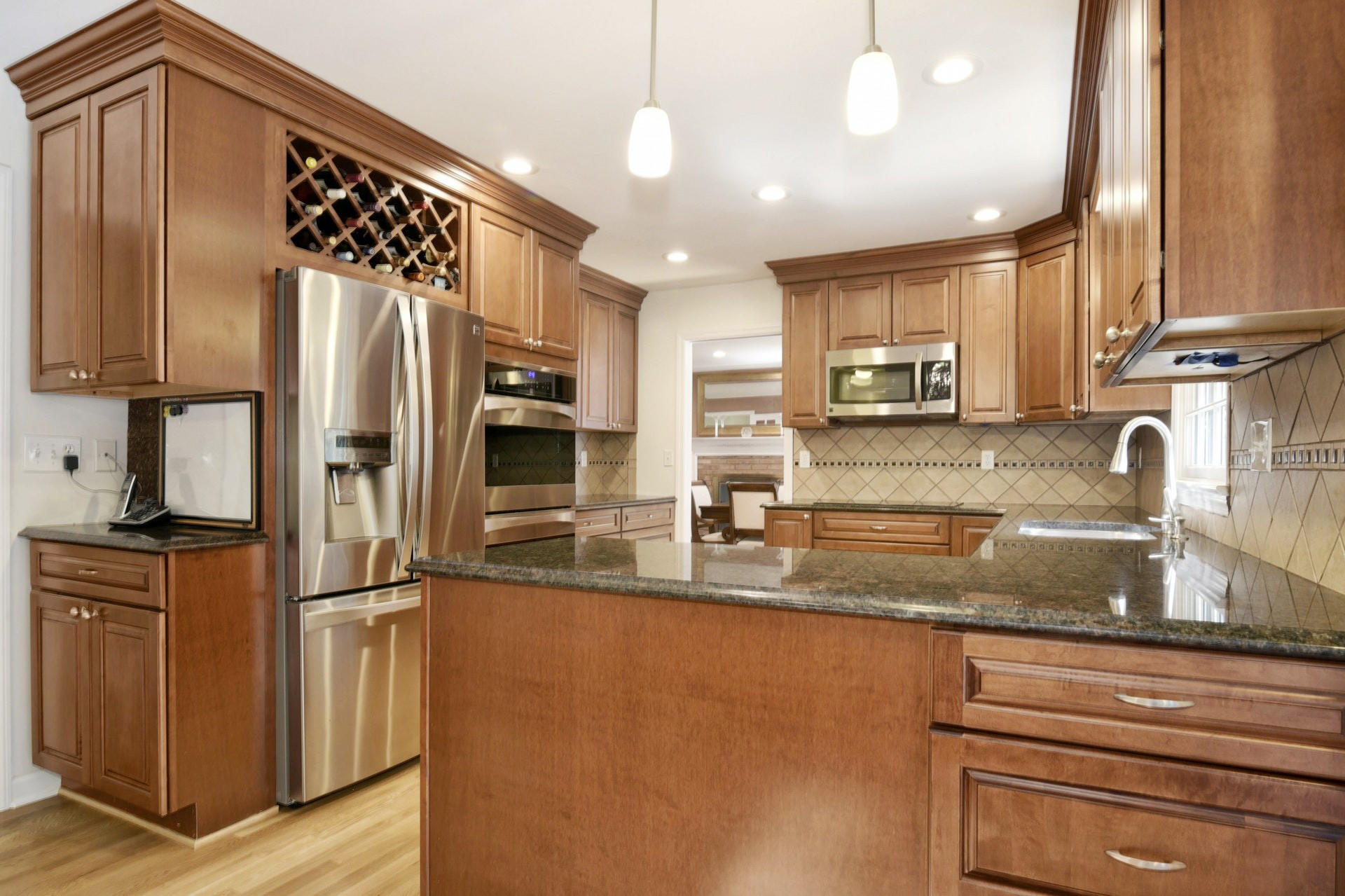1 Country Club Road Darien, CT 06820 - Photo 9 of 25 a kitchen with stainless steel appliances granite countertop a refrigerator a stove and a sink