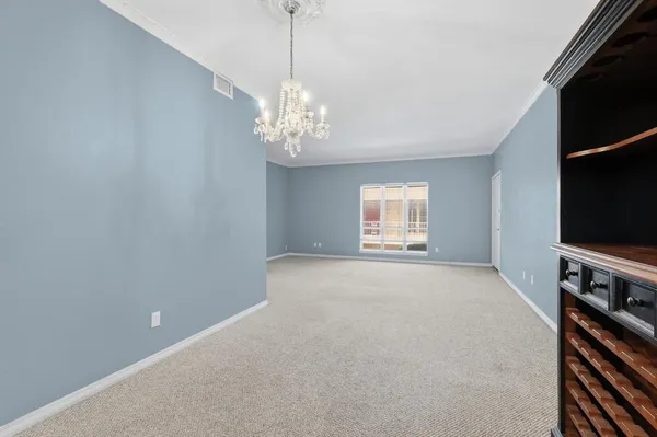 a kitchen with a sink a refrigerator and cabinets