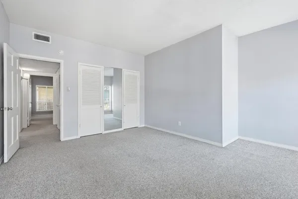 a bathroom with a shower and a toilet