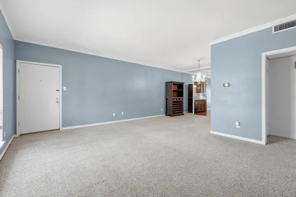 a view of empty room with furniture
