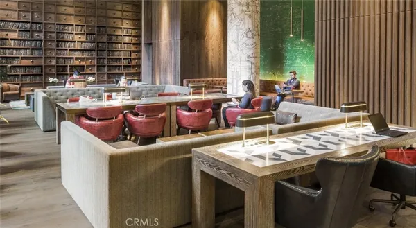 a view of a living room and kitchen with furniture