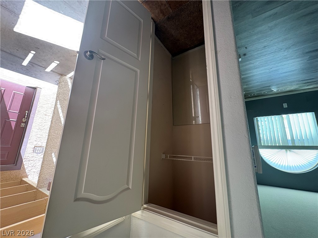 9325 West Desert Inn Road, Unit 123 Las Vegas, NV 89117 - Photo 5 of 36 An inviting entrance with a private porch and convenient utility closet.