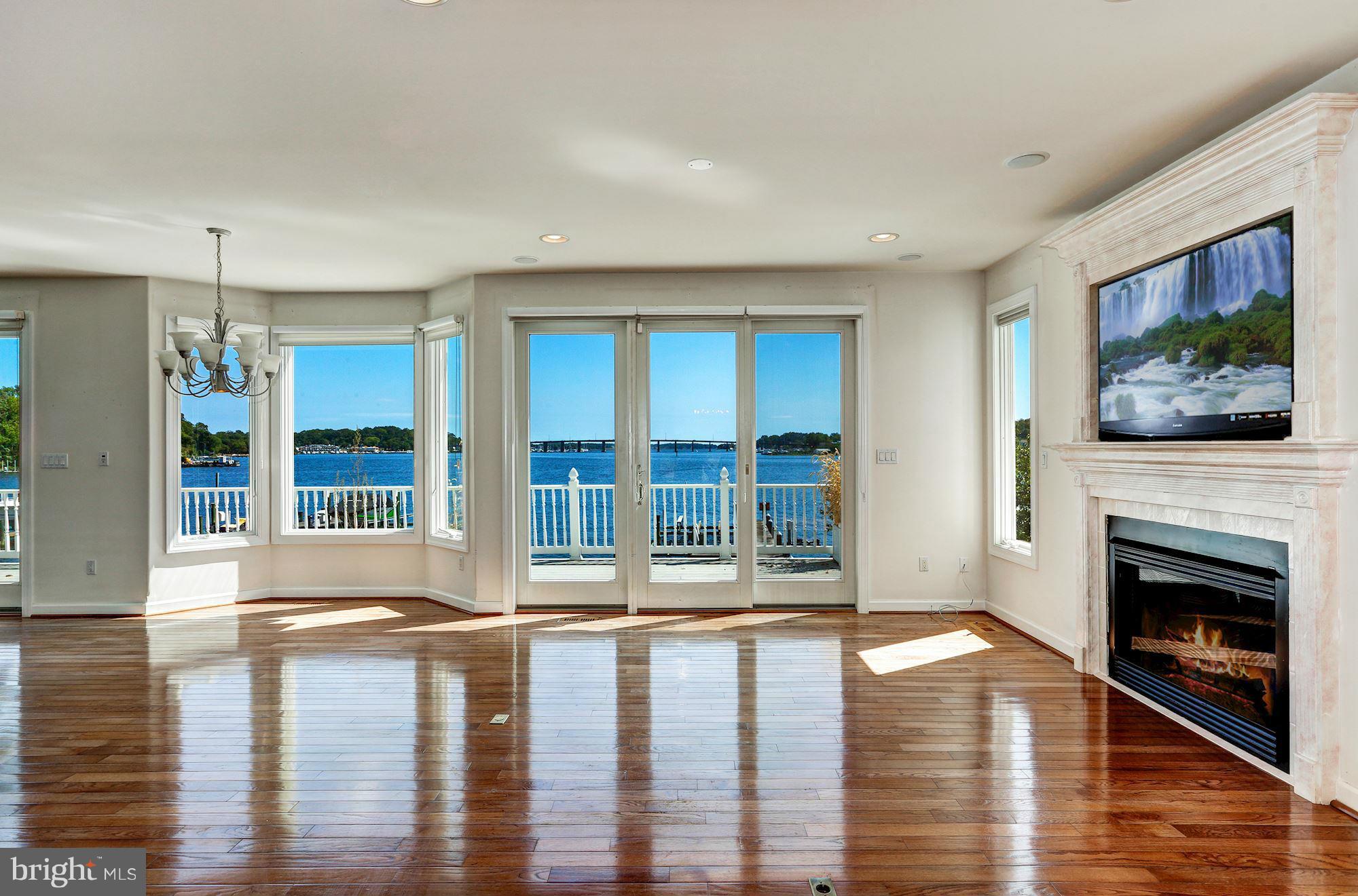 3027 Friends Road Annapolis, MD 21401 - Photo 9 of 30 Living Room with Fireplace and Beautiful Views