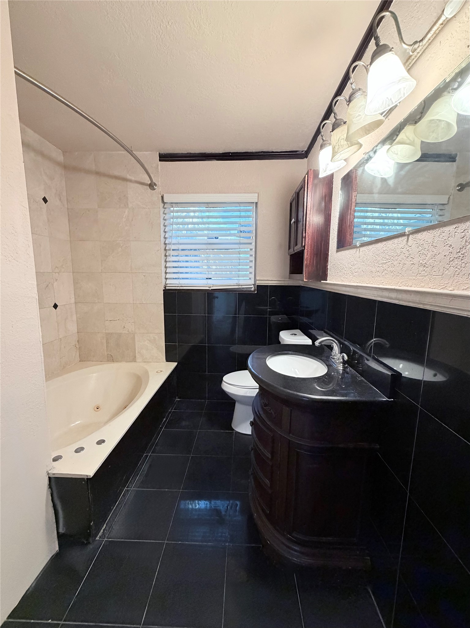 618 Sulphur Street Houston, TX 77034 - Photo 15 of 25 a bathroom with a sink and a mirror