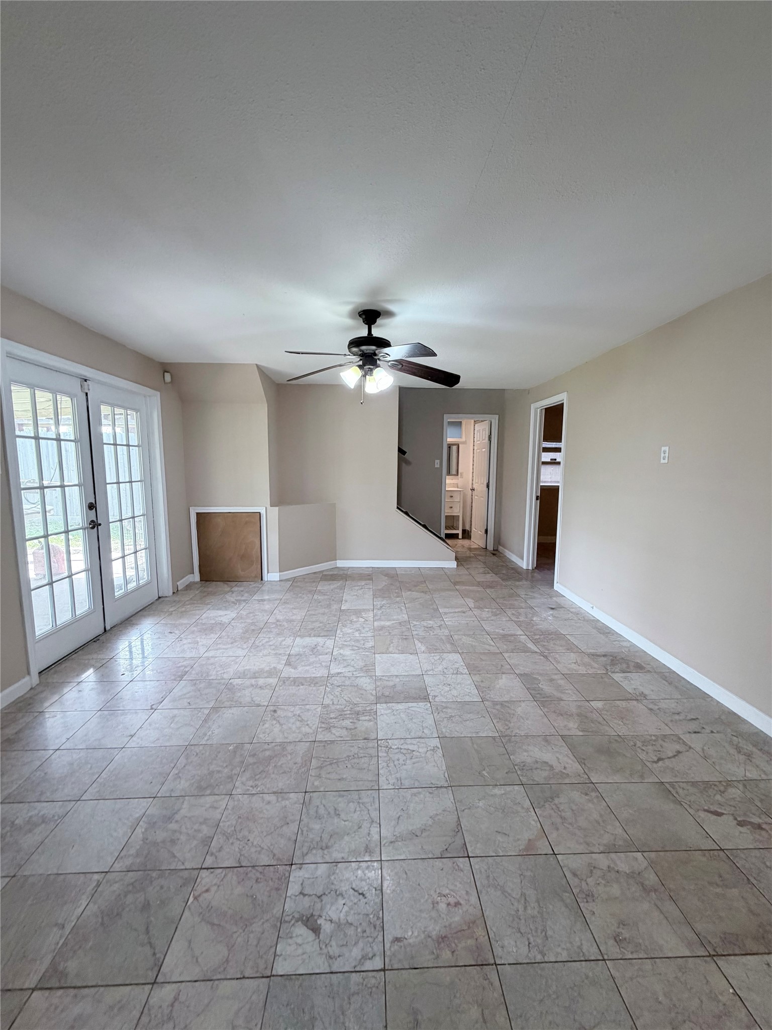 618 Sulphur Street Houston, TX 77034 - Photo 16 of 25 a view of a big room with windows and chandelier fan