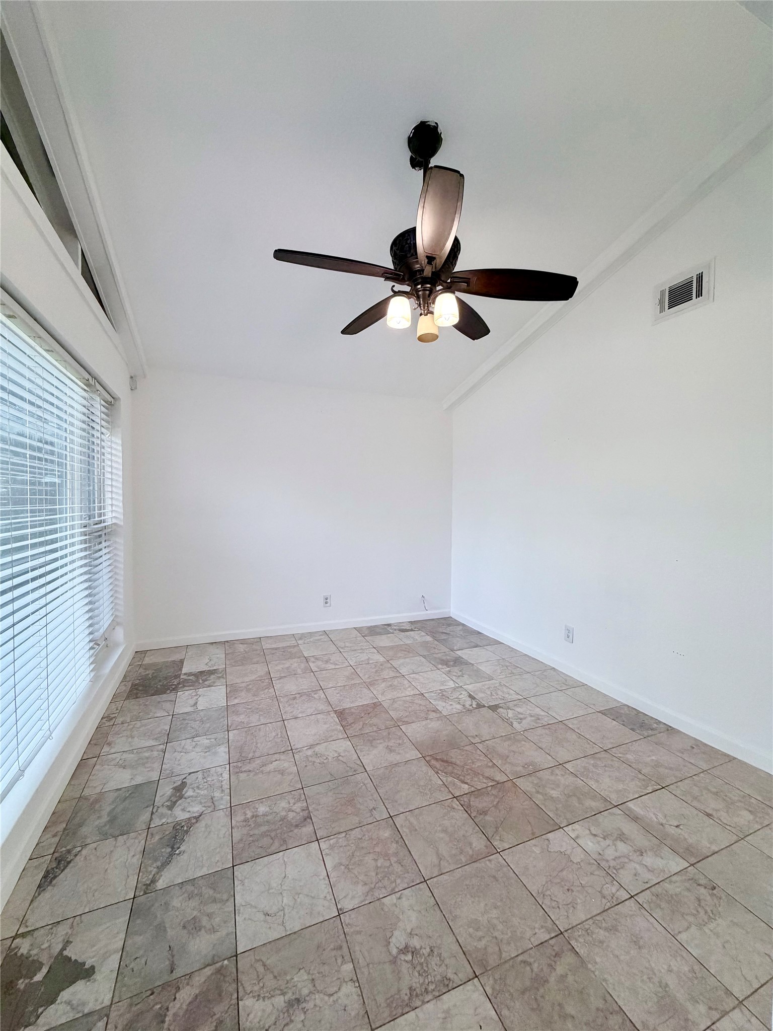 618 Sulphur Street Houston, TX 77034 - Photo 4 of 25 a view of a livingroom with a ceiling fan and window