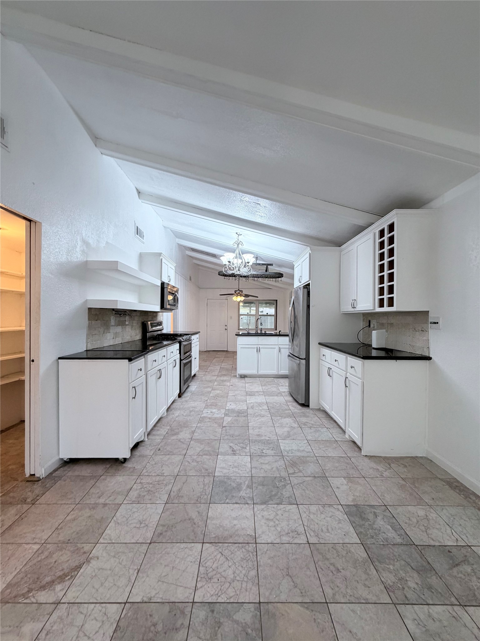 618 Sulphur Street Houston, TX 77034 - Photo 6 of 25 a large kitchen with cabinets