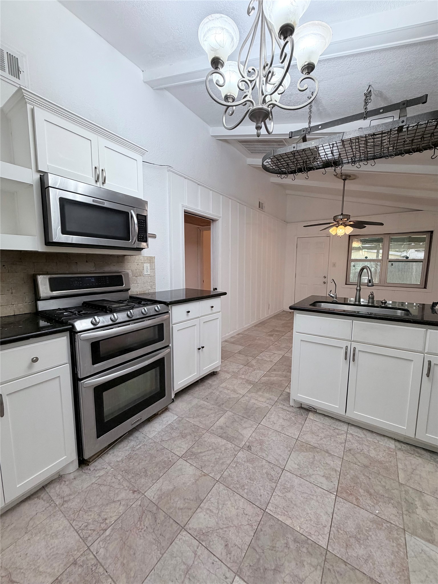618 Sulphur Street Houston, TX 77034 - Photo 7 of 25 a kitchen with a stove and cabinets