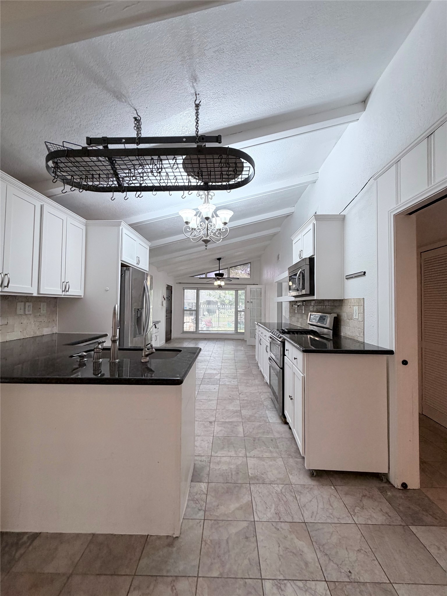 618 Sulphur Street Houston, TX 77034 - Photo 9 of 25 a kitchen with stainless steel appliances granite countertop a sink and cabinets