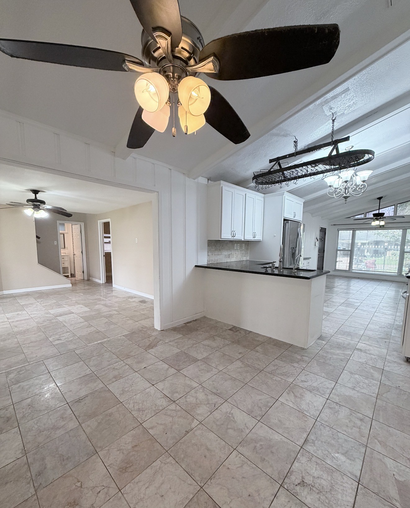 618 Sulphur Street Houston, TX 77034 - Photo 10 of 25 a view of a kitchen with a stove cabinets and a ceiling fan