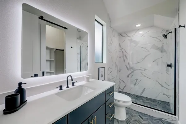 a bathroom with a double vanity sink and a