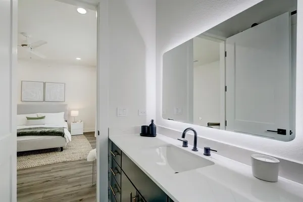 a bedroom with a bed and a table