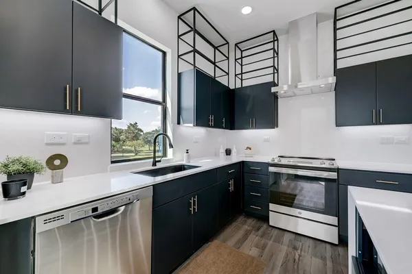 a kitchen with a sink and cabinets