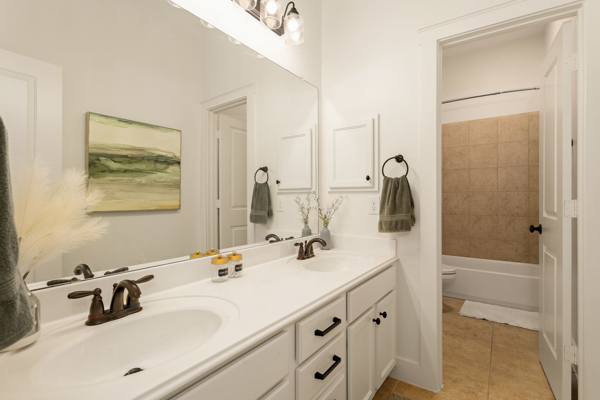 16650 Seminole Ridge Drive Cypress, TX 77433 - Photo 21 of 27 a bathroom with a double vanity sink mirror and double