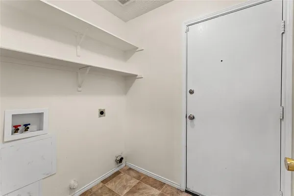 a view of small space with racks on the wall