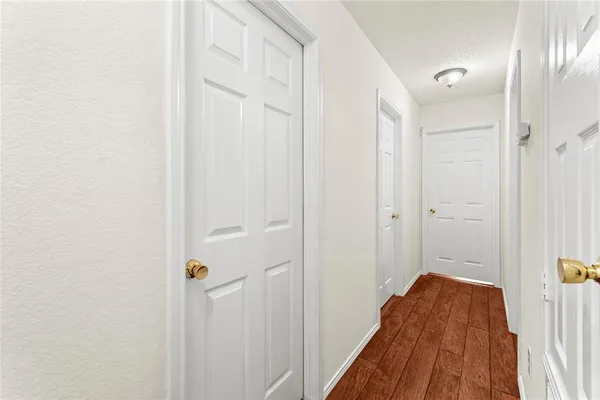 a view of a livingroom with wooden floor