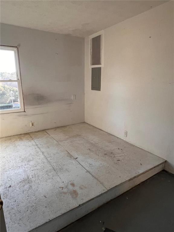 1401 Stone Bridge Lane Conyers, GA 30094 - Photo 20 of 27 an empty room with a window