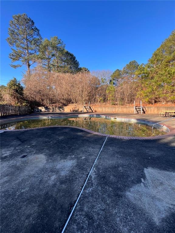 1401 Stone Bridge Lane Conyers, GA 30094 - Photo 23 of 27 a view of a yard with an outdoor space
