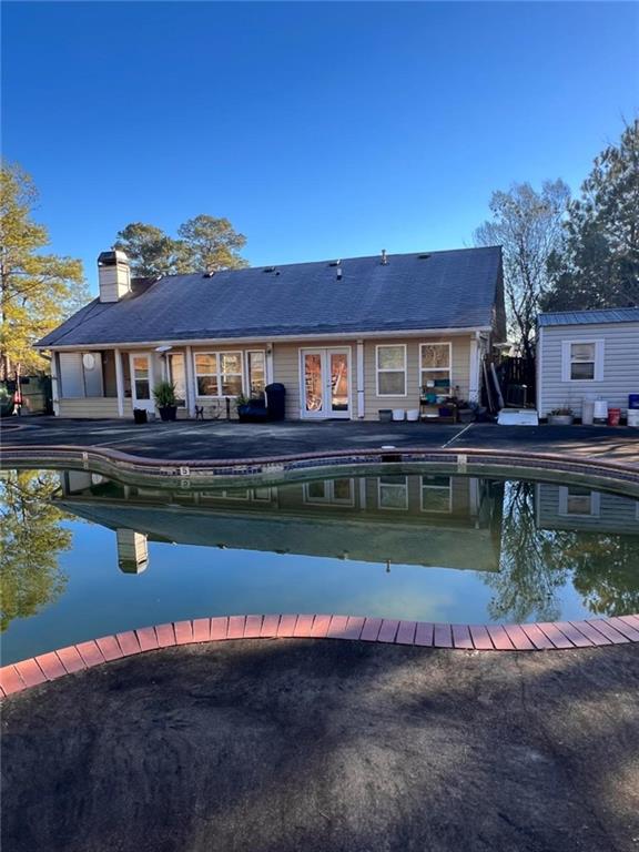 1401 Stone Bridge Lane Conyers, GA 30094 - Photo 25 of 27 a house with river in front of it
