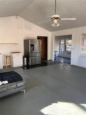 a living room with furniture and chandelier