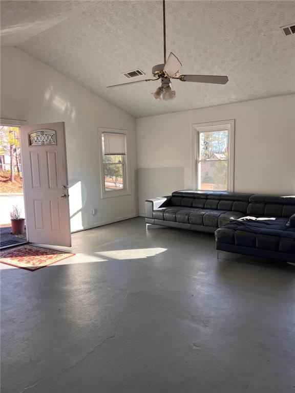 1401 Stone Bridge Lane Conyers, GA 30094 - Photo 6 of 27 a view of a livingroom with furniture and chandelier