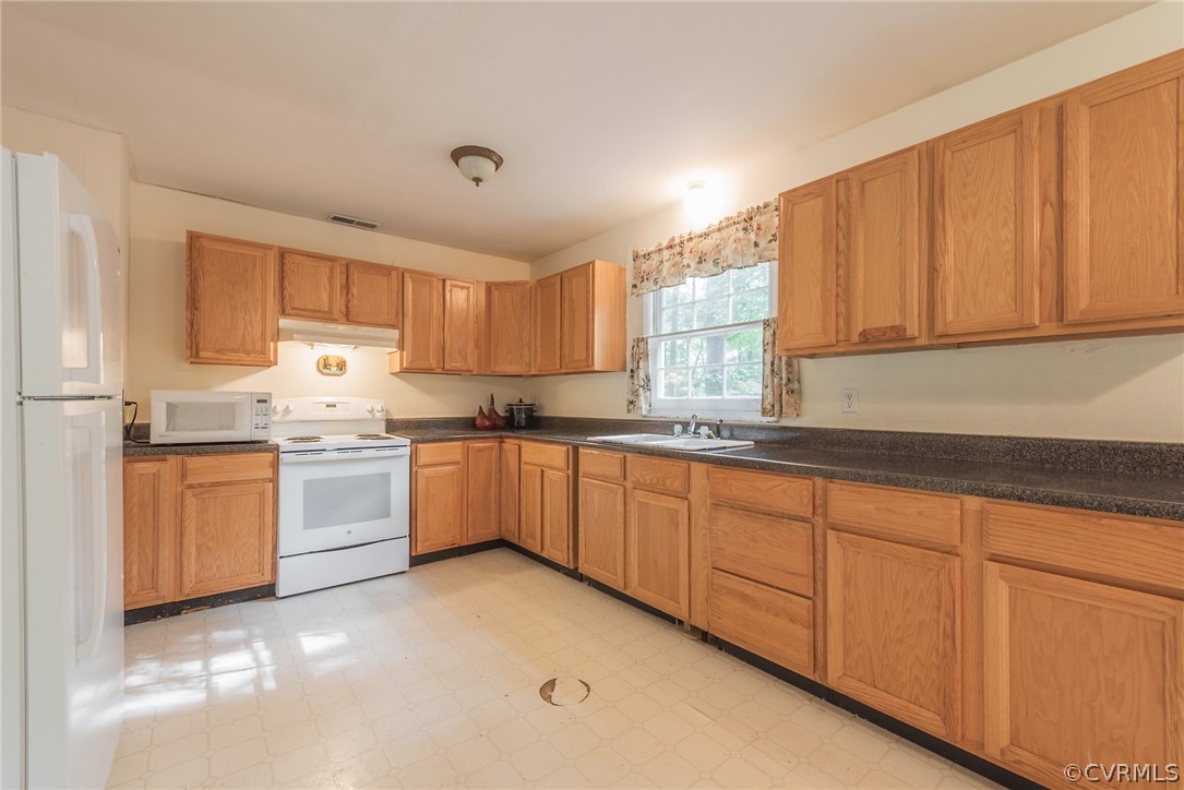 2937 Shiloh Church Road Midlothian, VA 23112 - Photo 11 of 24 a kitchen with granite countertop white cabinets sink and white appliances