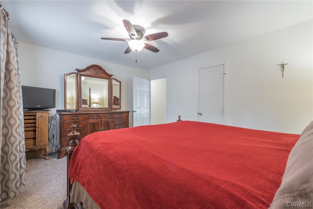 2937 Shiloh Church Road Midlothian, VA 23112 - Photo 14 of 24 a bedroom with a bed and a flat screen tv
