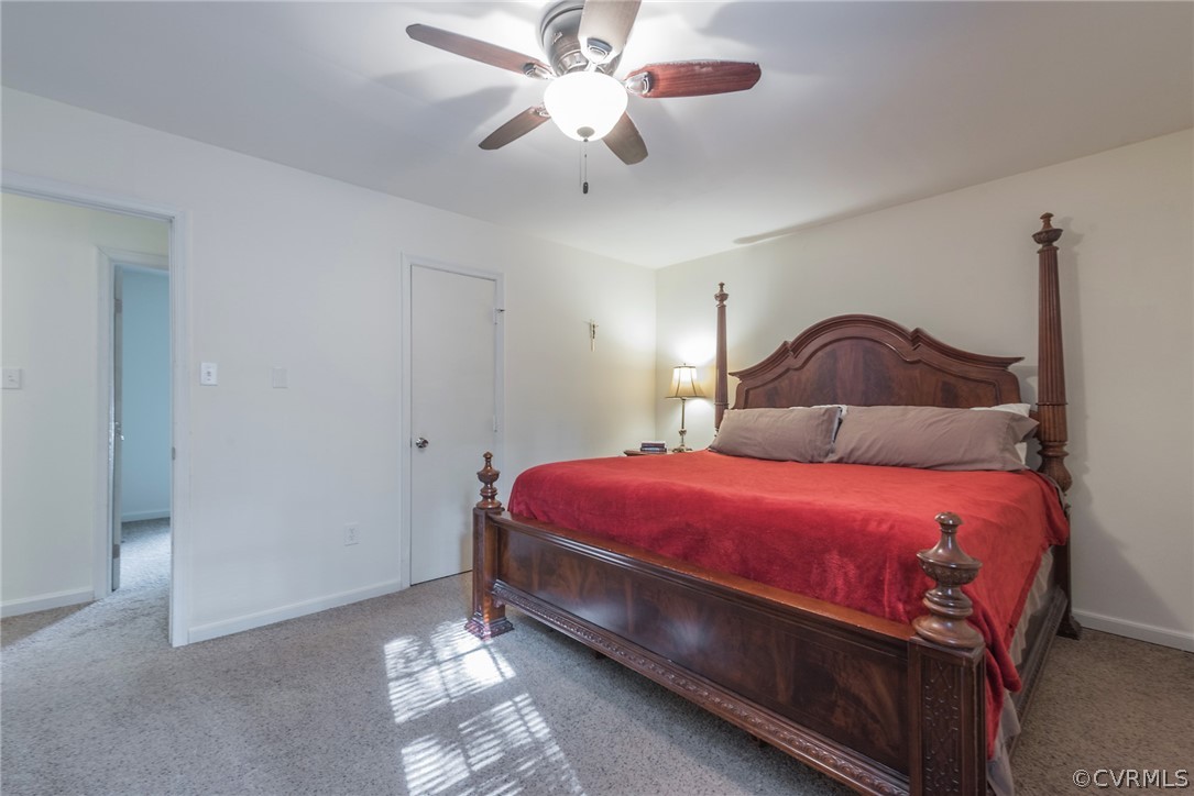 2937 Shiloh Church Road Midlothian, VA 23112 - Photo 15 of 24 a bedroom with a bed and a chandelier