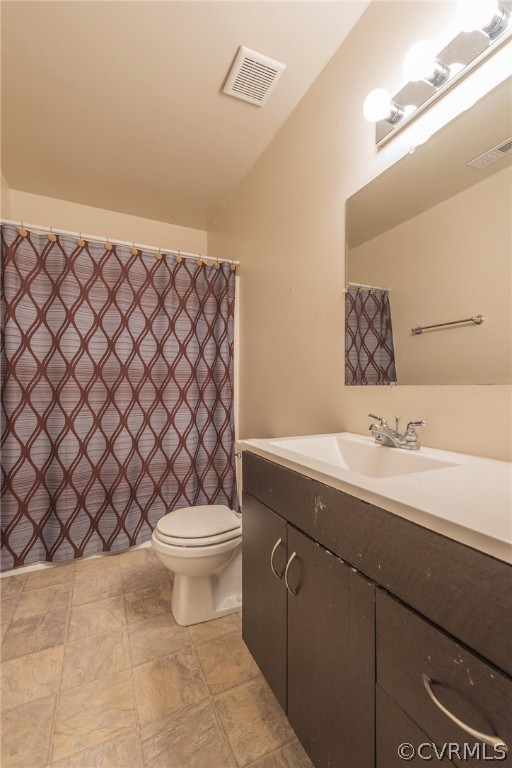 2937 Shiloh Church Road Midlothian, VA 23112 - Photo 16 of 24 a bathroom with a sink a toilet and a mirror