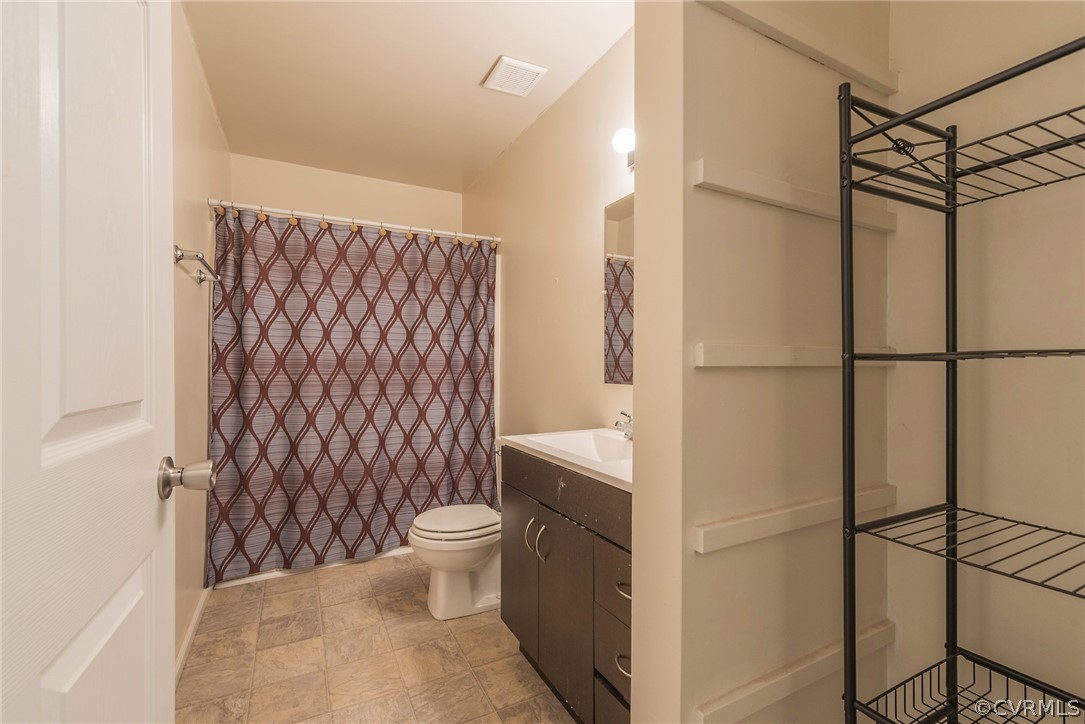 2937 Shiloh Church Road Midlothian, VA 23112 - Photo 17 of 24 a bathroom with a toilet and a shower