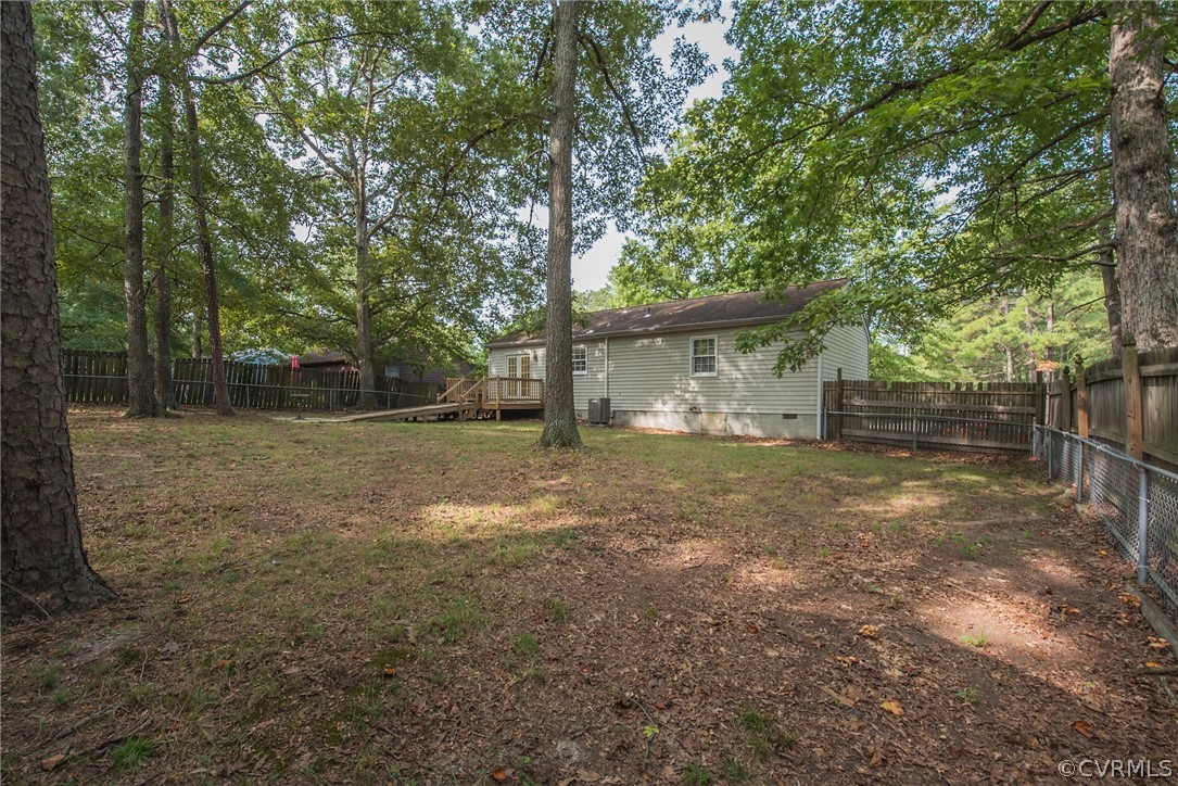 2937 Shiloh Church Road Midlothian, VA 23112 - Photo 21 of 24 a view of a backyard with large trees