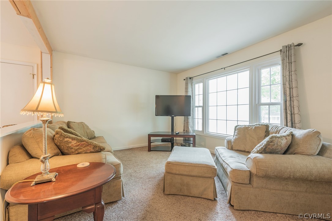 2937 Shiloh Church Road Midlothian, VA 23112 - Photo 8 of 24 a living room with furniture and a flat screen tv
