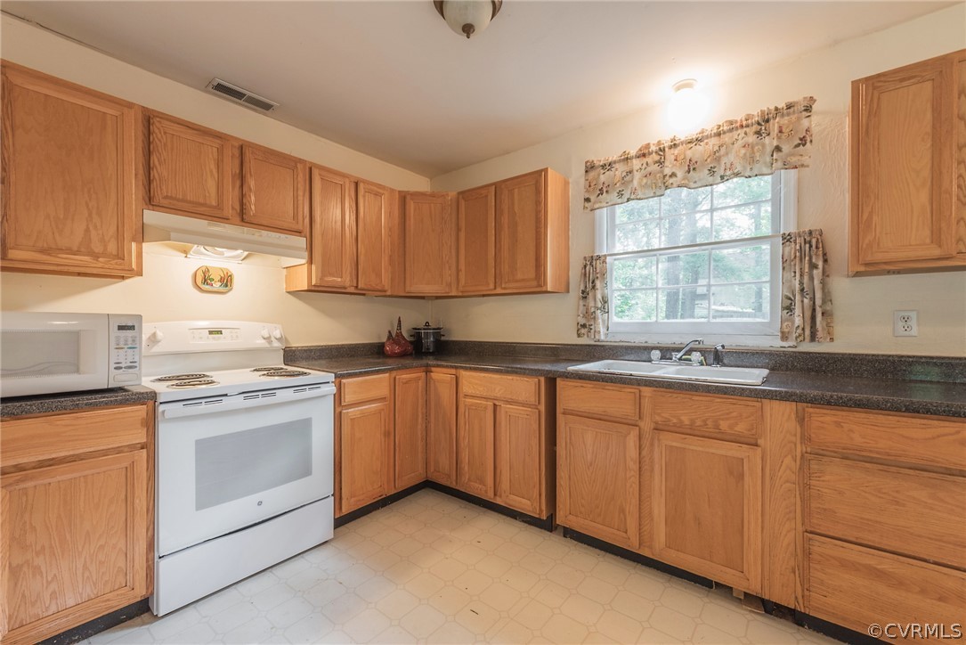 2937 Shiloh Church Road Midlothian, VA 23112 - Photo 9 of 24 a kitchen with granite countertop white cabinets and white appliances