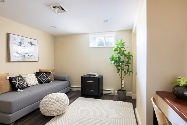 a bedroom with a bed and a couch