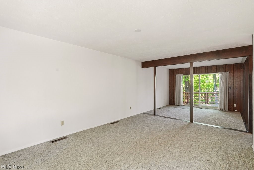 17482 Falling Water Road Strongsville, OH 44136 - Photo 5 of 33 Living and dining rooms with beautiful wooded views