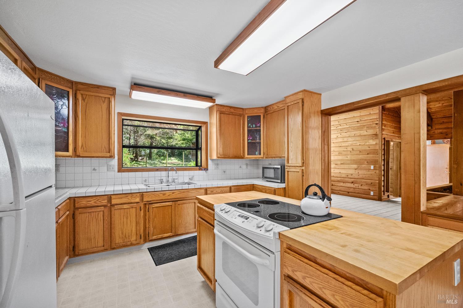 46320 Iversen Road Gualala, CA 95445 - Photo 11 of 46 a kitchen that has a sink and a stove in it
