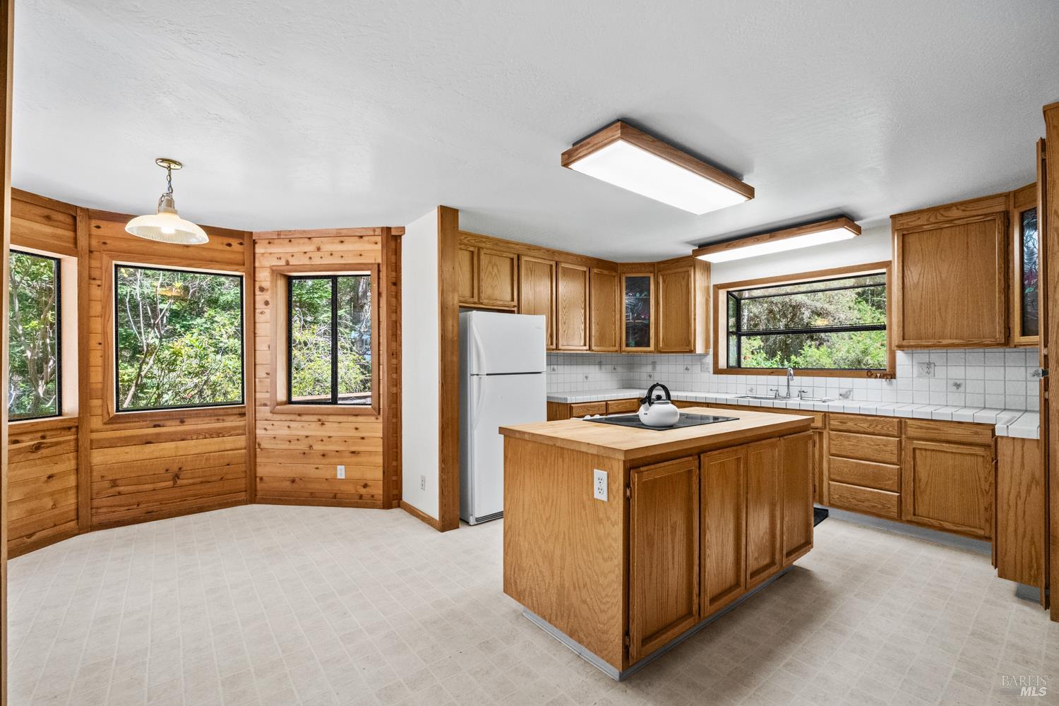 46320 Iversen Road Gualala, CA 95445 - Photo 13 of 46 a kitchen with stainless steel appliances granite countertop a stove and a refrigerator