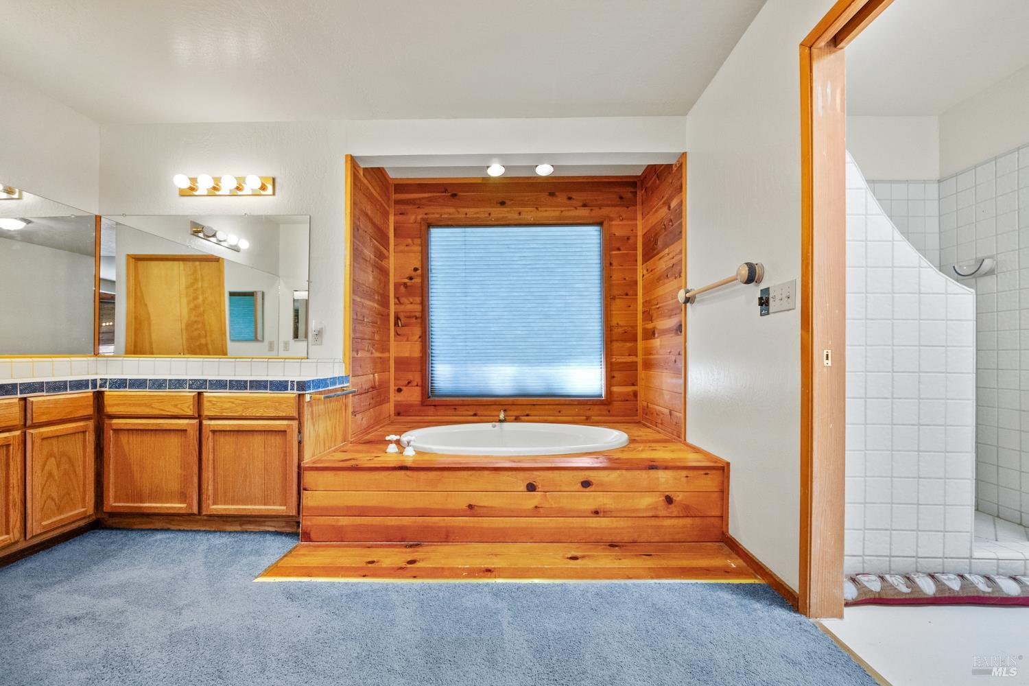 46320 Iversen Road Gualala, CA 95445 - Photo 20 of 46 a bathroom with a tub sink and mirror