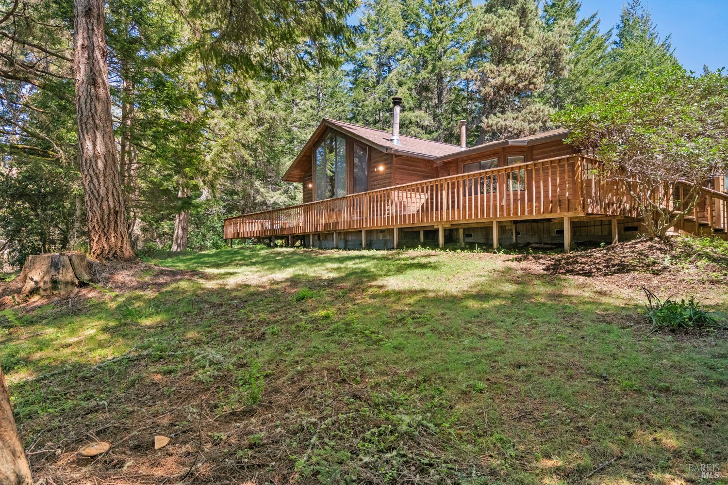 46320 Iversen Road Gualala, CA 95445 - Photo 36 of 46 a view of a house with a yard