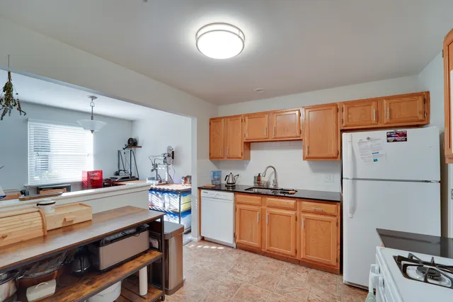 a kitchen with a sink appliances and cabinets