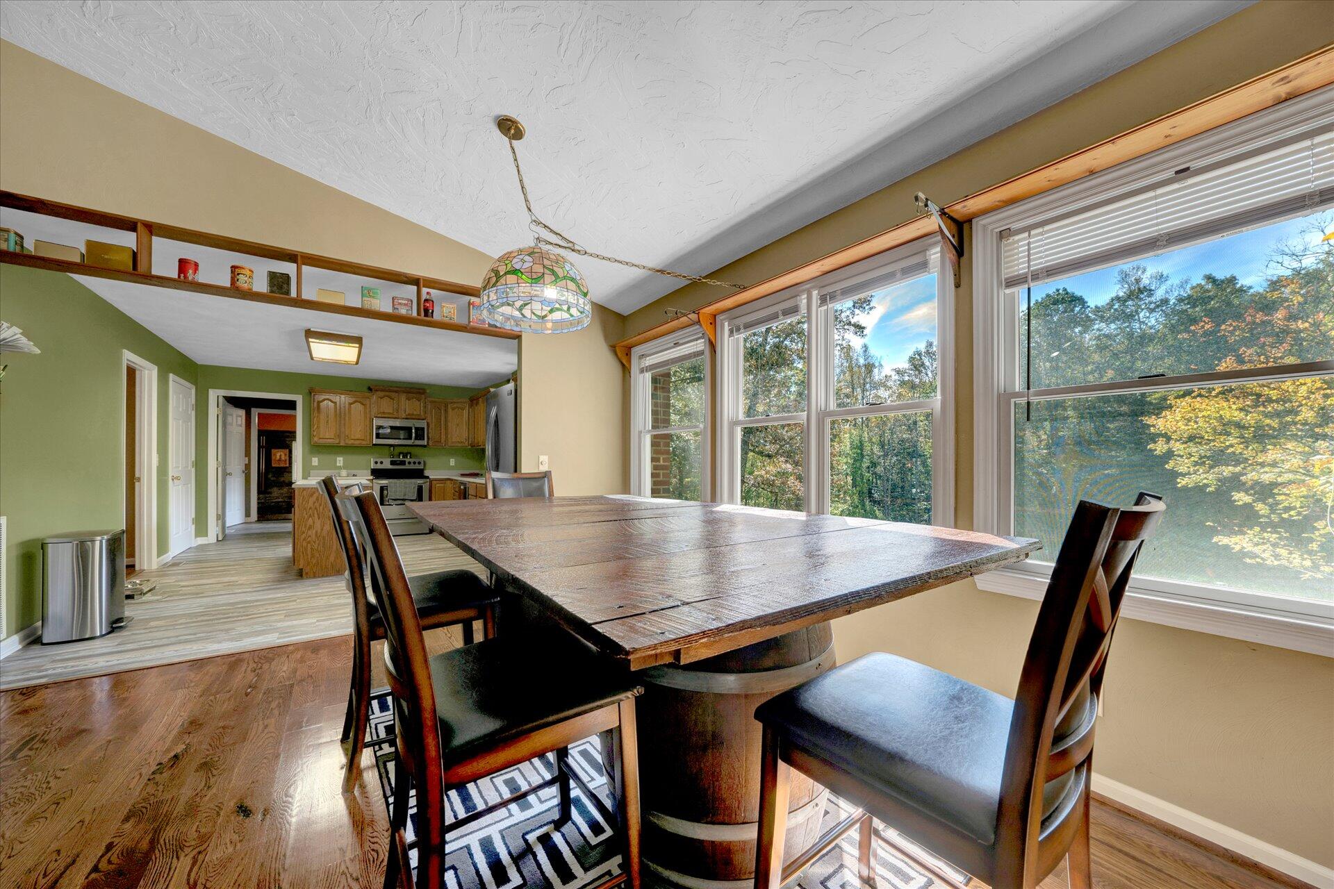 1041 Owen Ridge Lane Goodview, VA 24095 - Photo 16 of 58 a view of a dining room with furniture window and wooden floor