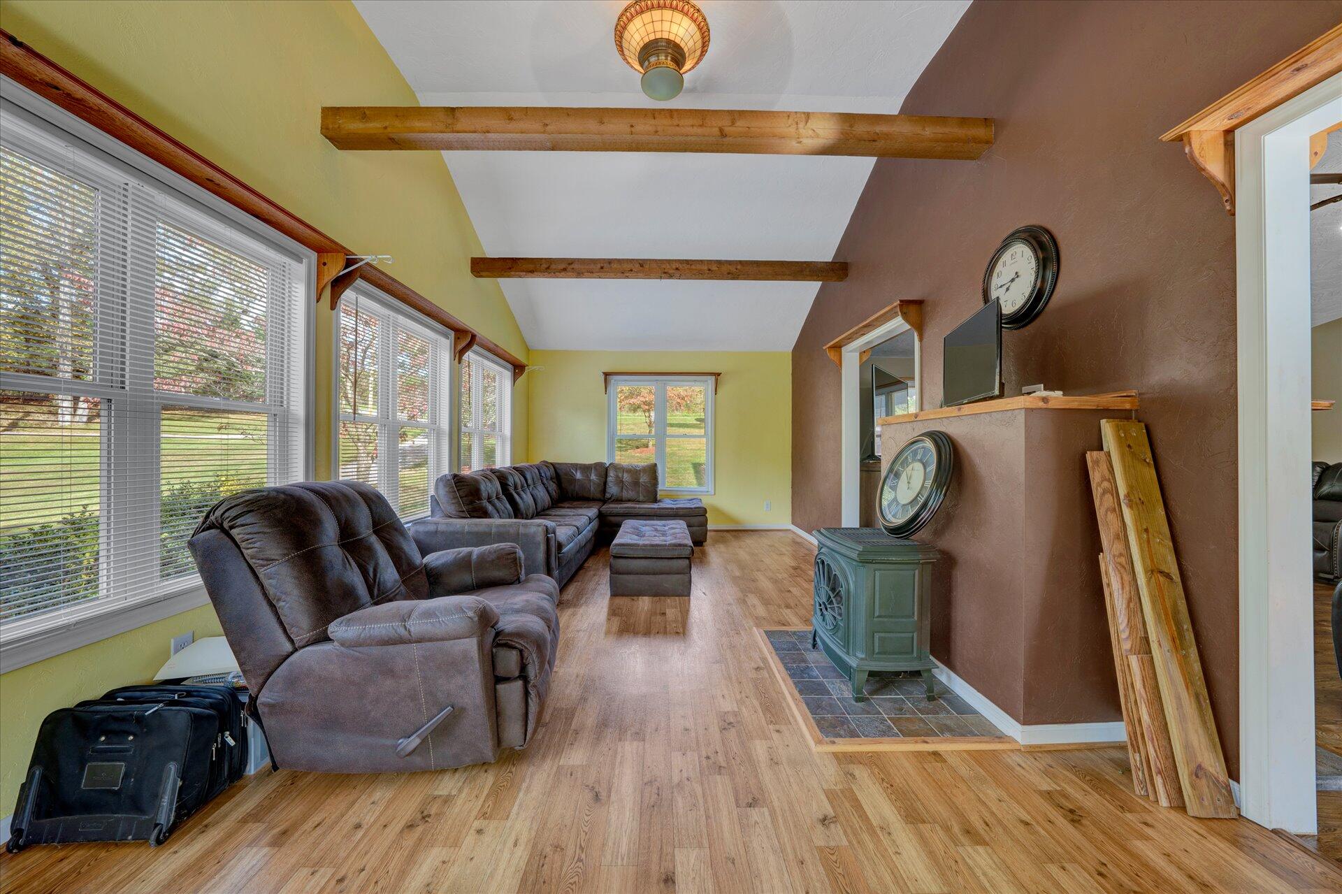 1041 Owen Ridge Lane Goodview, VA 24095 - Photo 19 of 58 a living room with furniture a window and wooden floor
